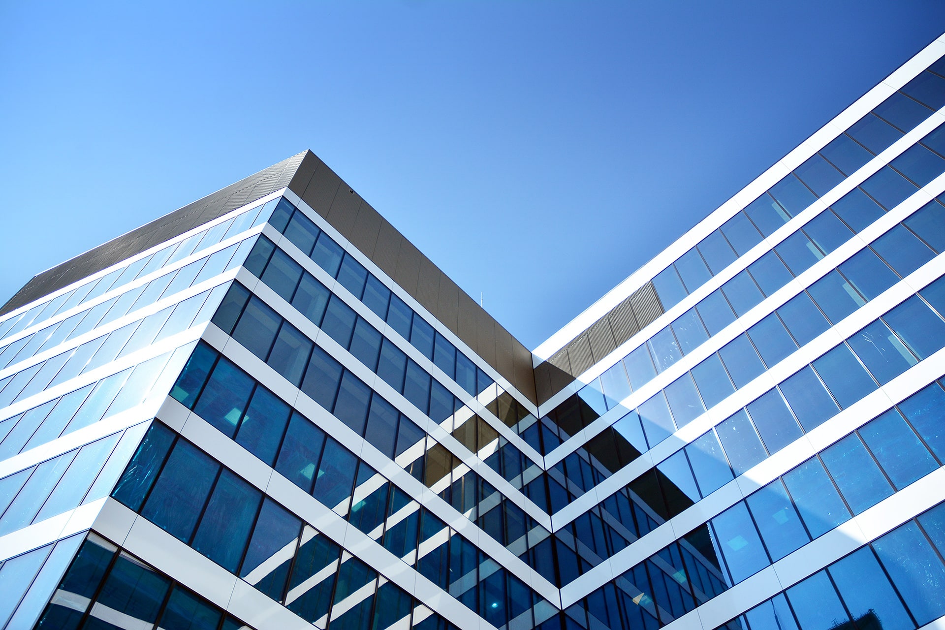 New office building in business center. Wall made of steel and glass.